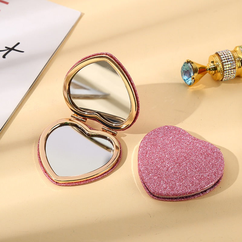 Eleganter, herzförmiger, glitzernder, faltbarer Kosmetikspiegel – roségoldener Rahmen, hypoallergenes Metall, tragbar und praktisch für Mädchen